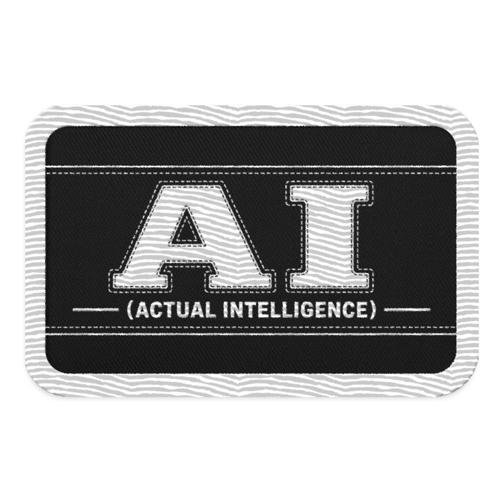 Black rectangle embroidered patch with white AI (Actual Intelligence) stitched lettering