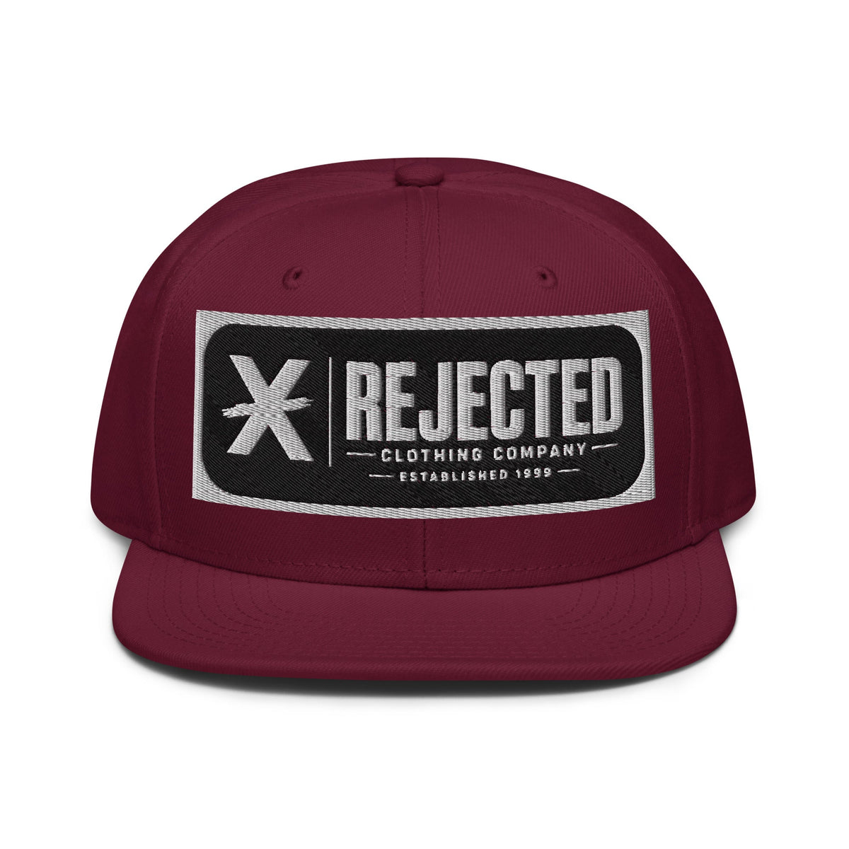 Black snapback with a teal brim and an embroidered Rejected Clothing Company Established 1999 patch