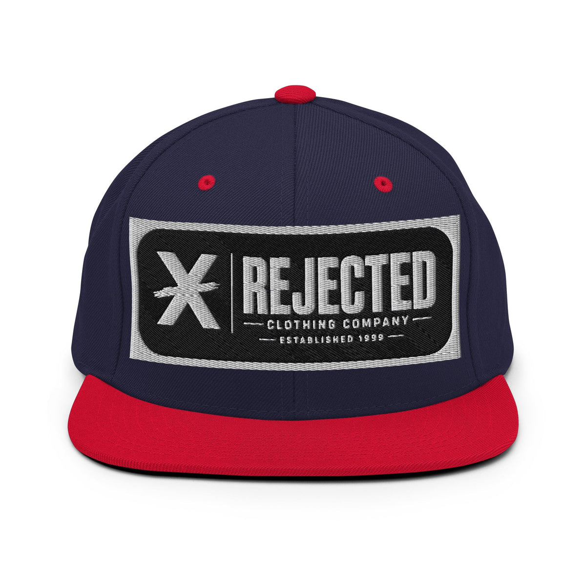 All-black snapback with an embroidered Rejected Clothing Company Established 1999 patch and a green undervisor