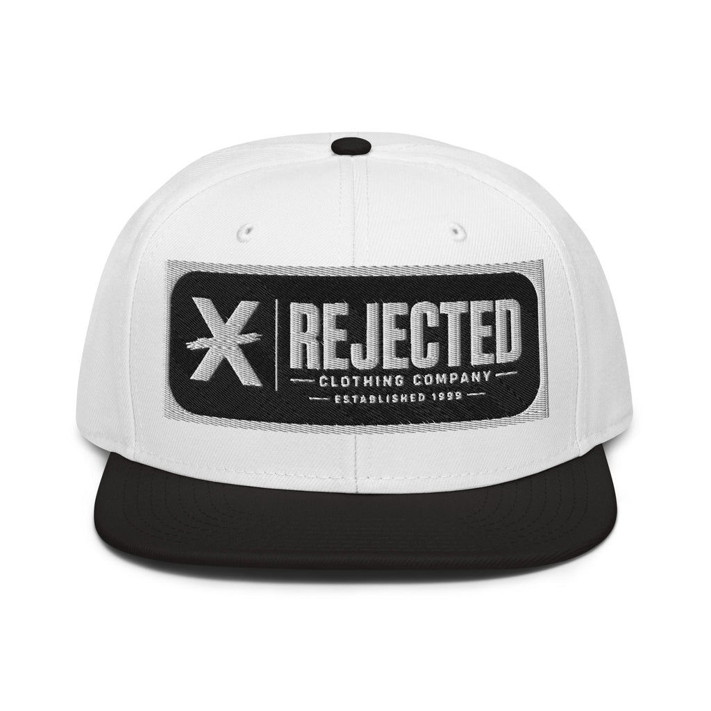 Black snapback with a teal brim and an embroidered Rejected Clothing Company Established 1999 patch