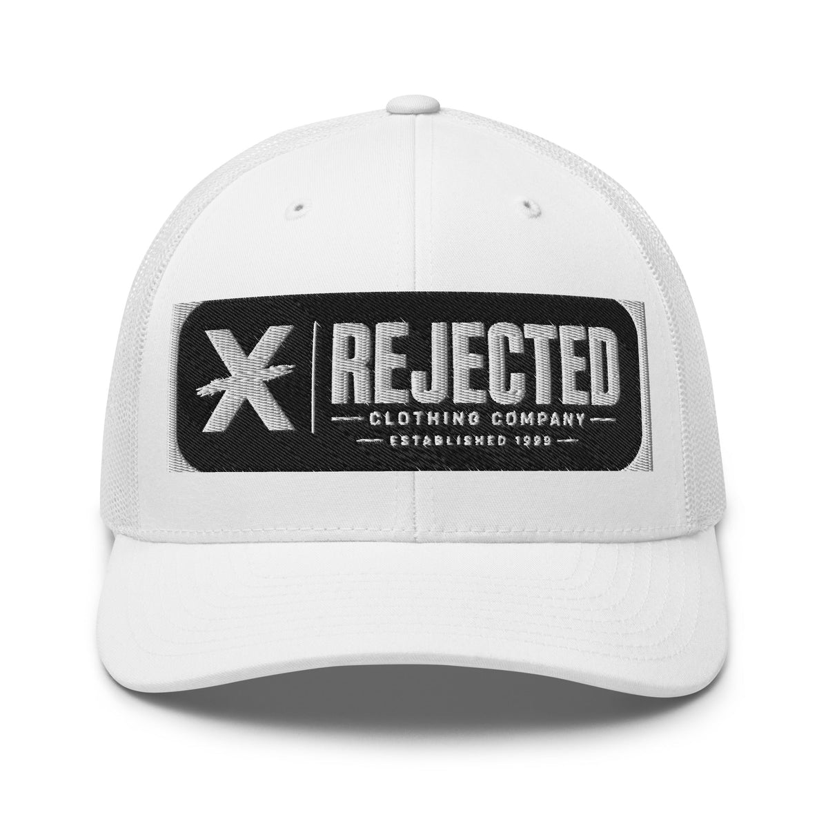 White trucker cap with an embroidered Rejected Clothing Company Established 1999 patch and X mark