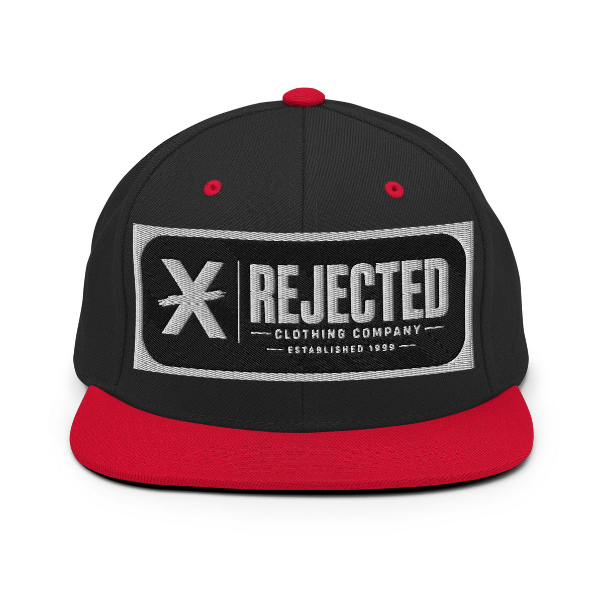 All-black snapback with an embroidered Rejected Clothing Company Established 1999 patch and a green undervisor