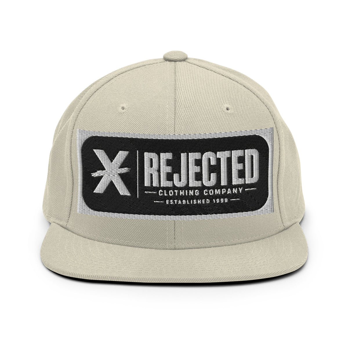 All-black snapback with an embroidered Rejected Clothing Company Established 1999 patch and a green undervisor