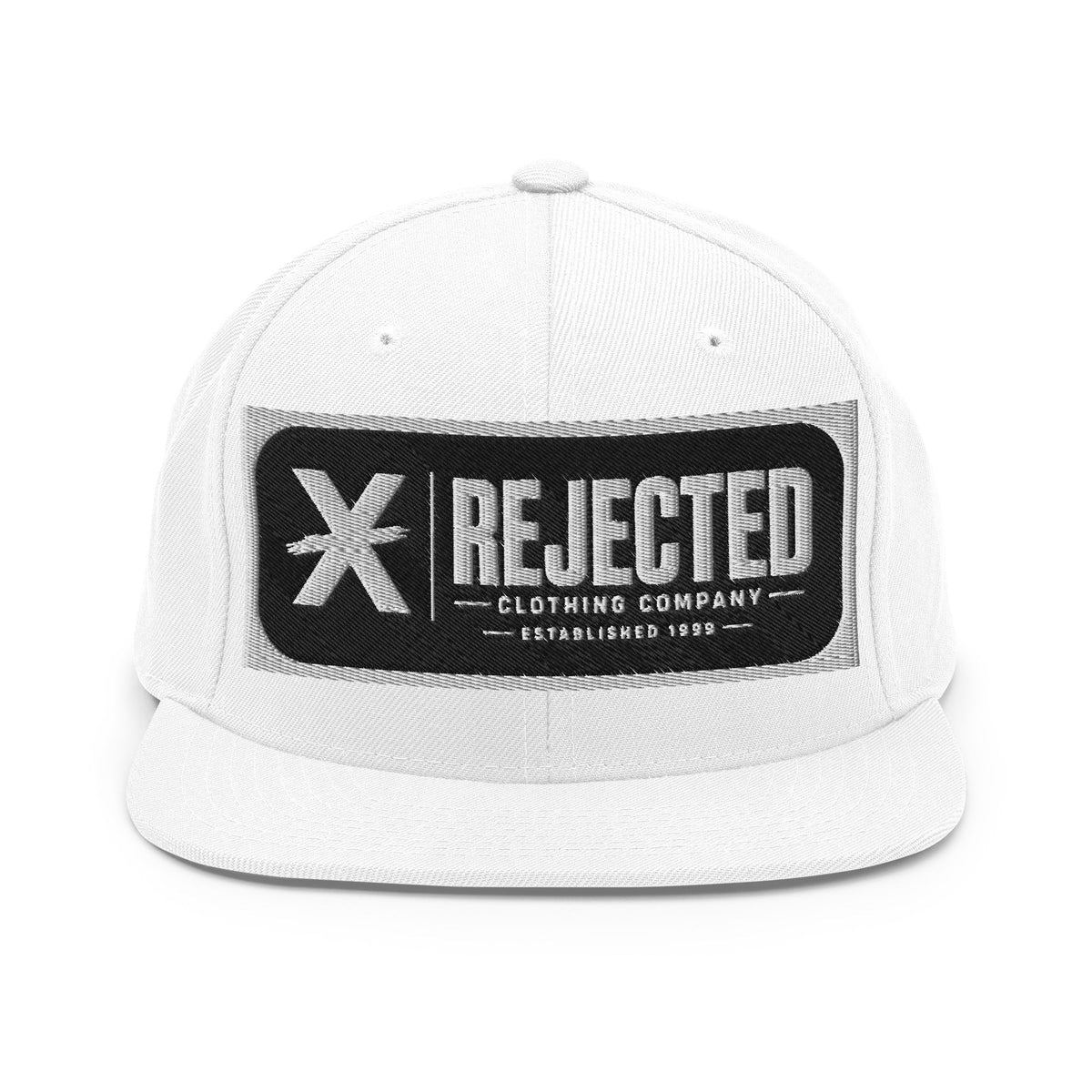 All-black snapback with an embroidered Rejected Clothing Company Established 1999 patch and a green undervisor