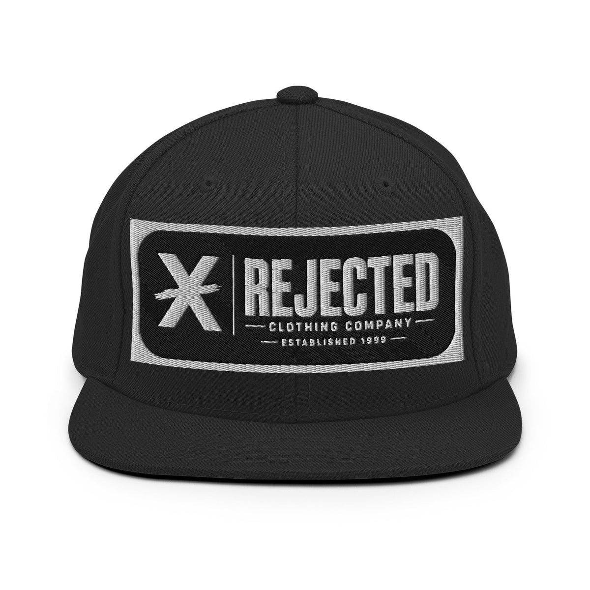 All-black snapback with an embroidered Rejected Clothing Company Established 1999 patch and a green undervisor