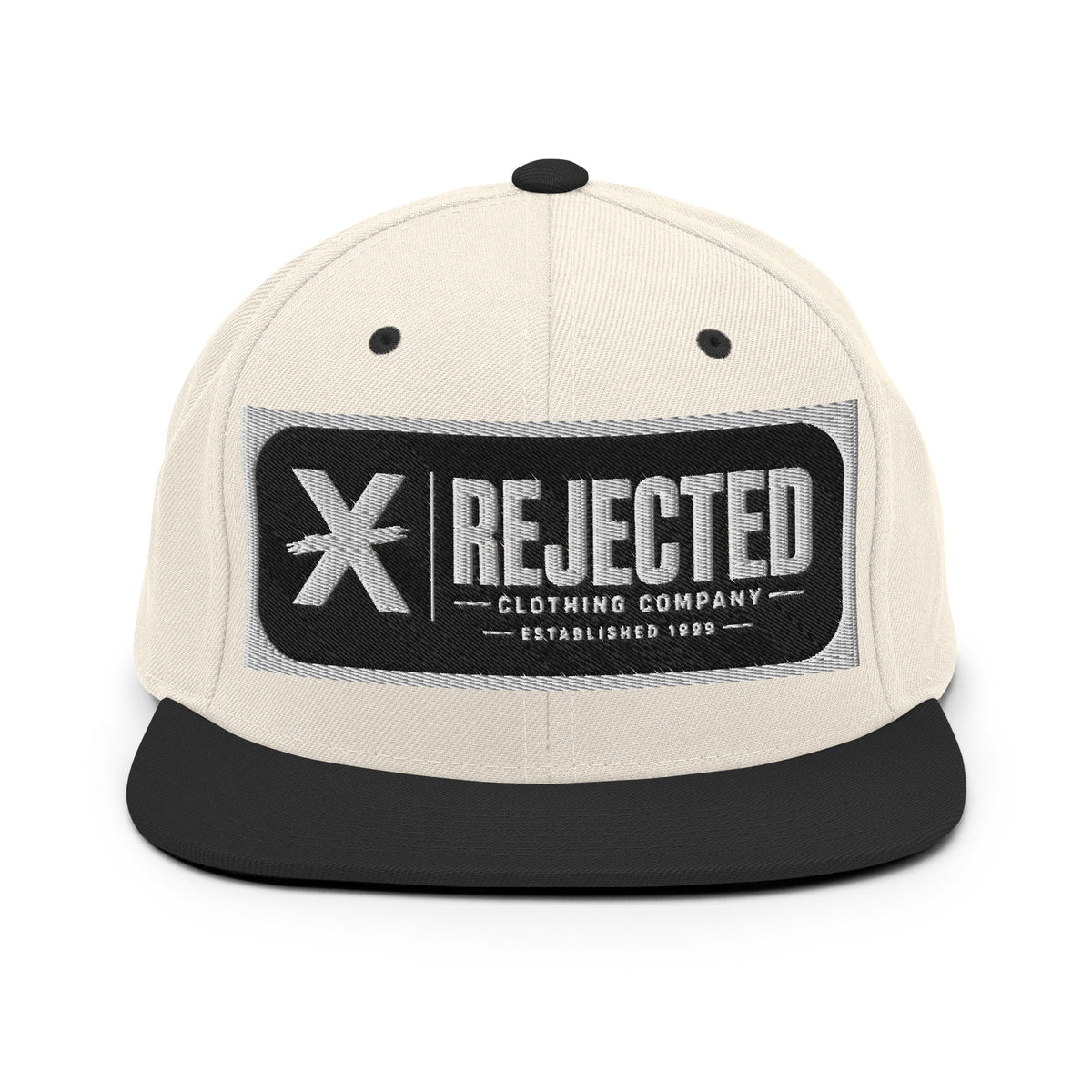 All-black snapback with an embroidered Rejected Clothing Company Established 1999 patch and a green undervisor