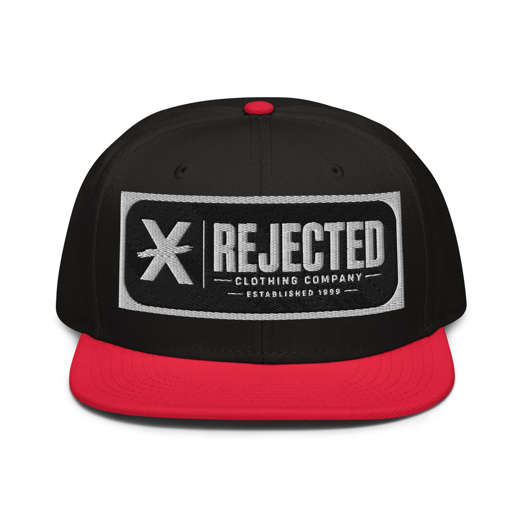 Black snapback with a teal brim and an embroidered Rejected Clothing Company Established 1999 patch