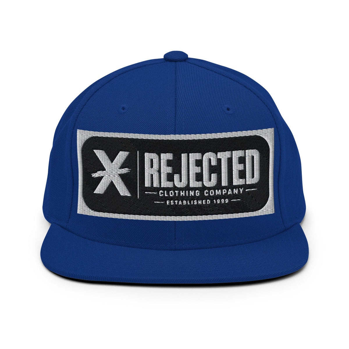 All-black snapback with an embroidered Rejected Clothing Company Established 1999 patch and a green undervisor