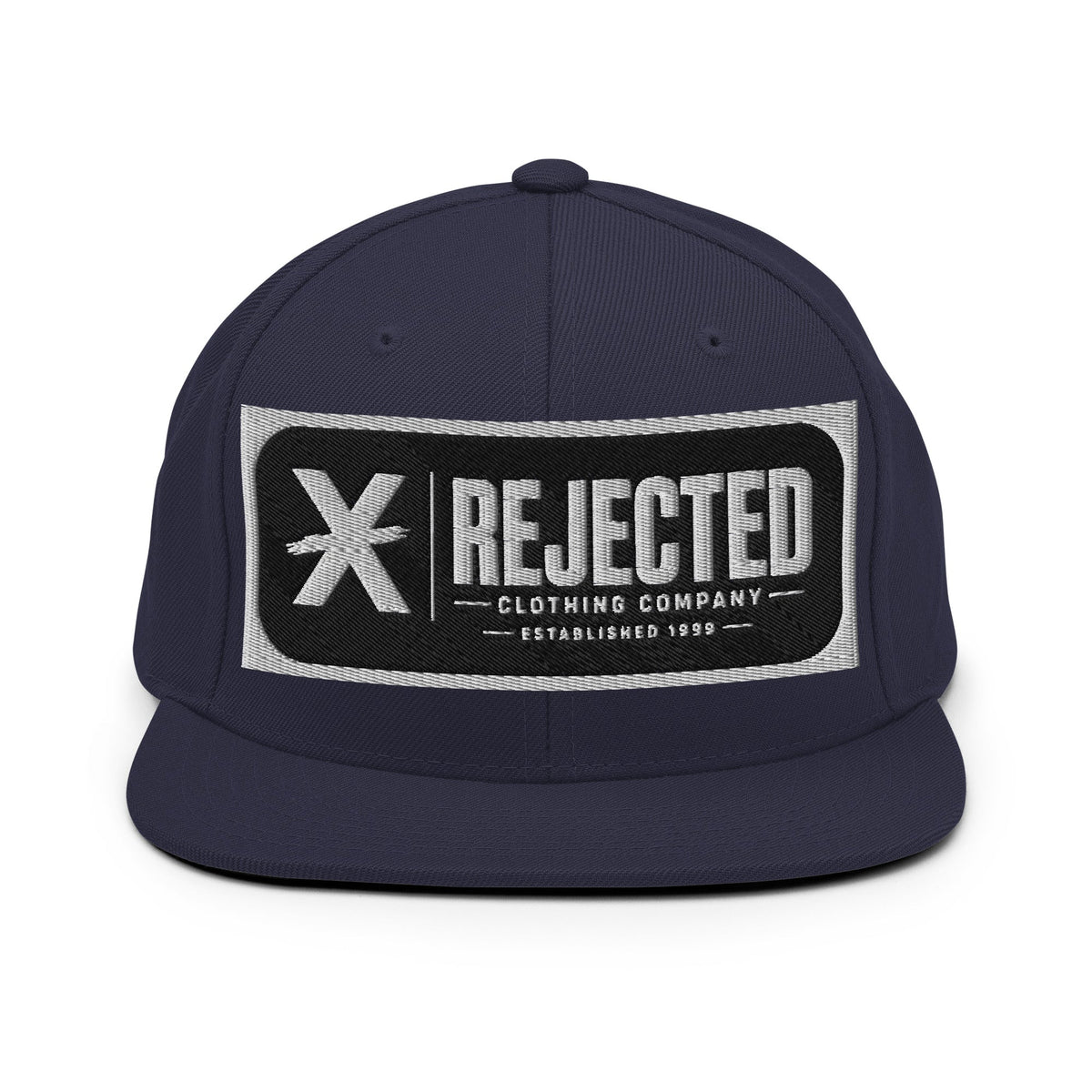All-black snapback with an embroidered Rejected Clothing Company Established 1999 patch and a green undervisor