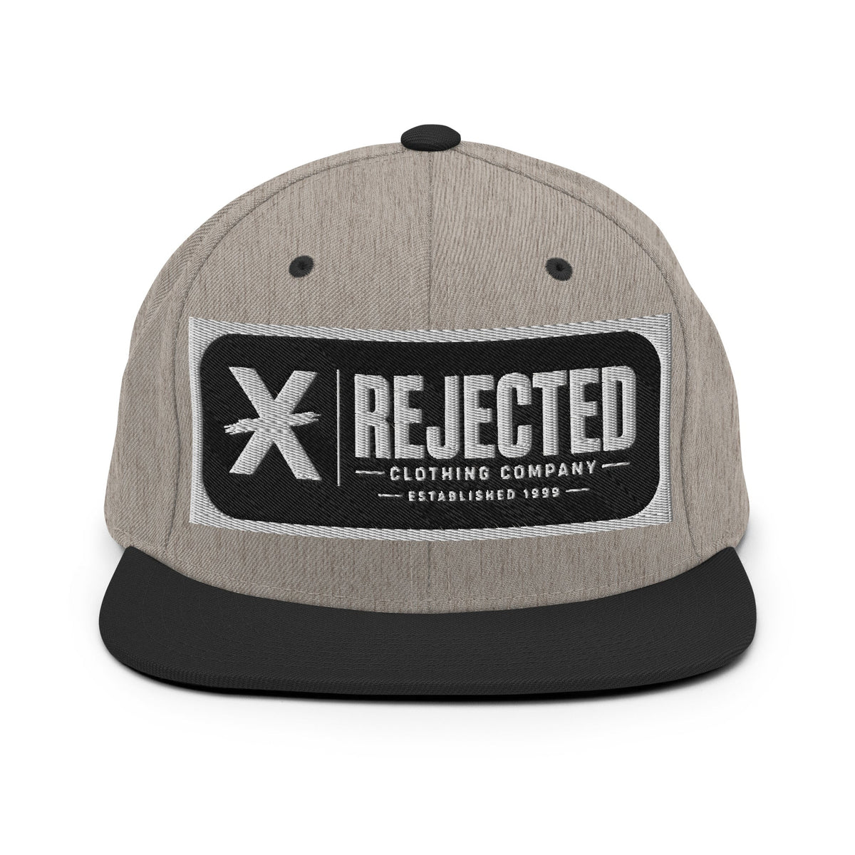 All-black snapback with an embroidered Rejected Clothing Company Established 1999 patch and a green undervisor