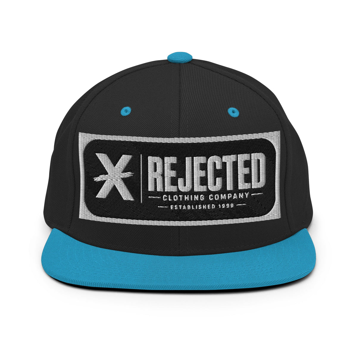 All-black snapback with an embroidered Rejected Clothing Company Established 1999 patch and a green undervisor