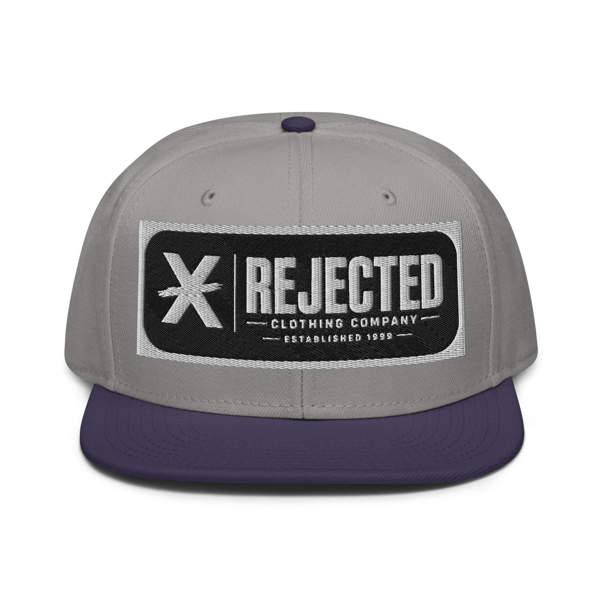 Black snapback with a teal brim and an embroidered Rejected Clothing Company Established 1999 patch