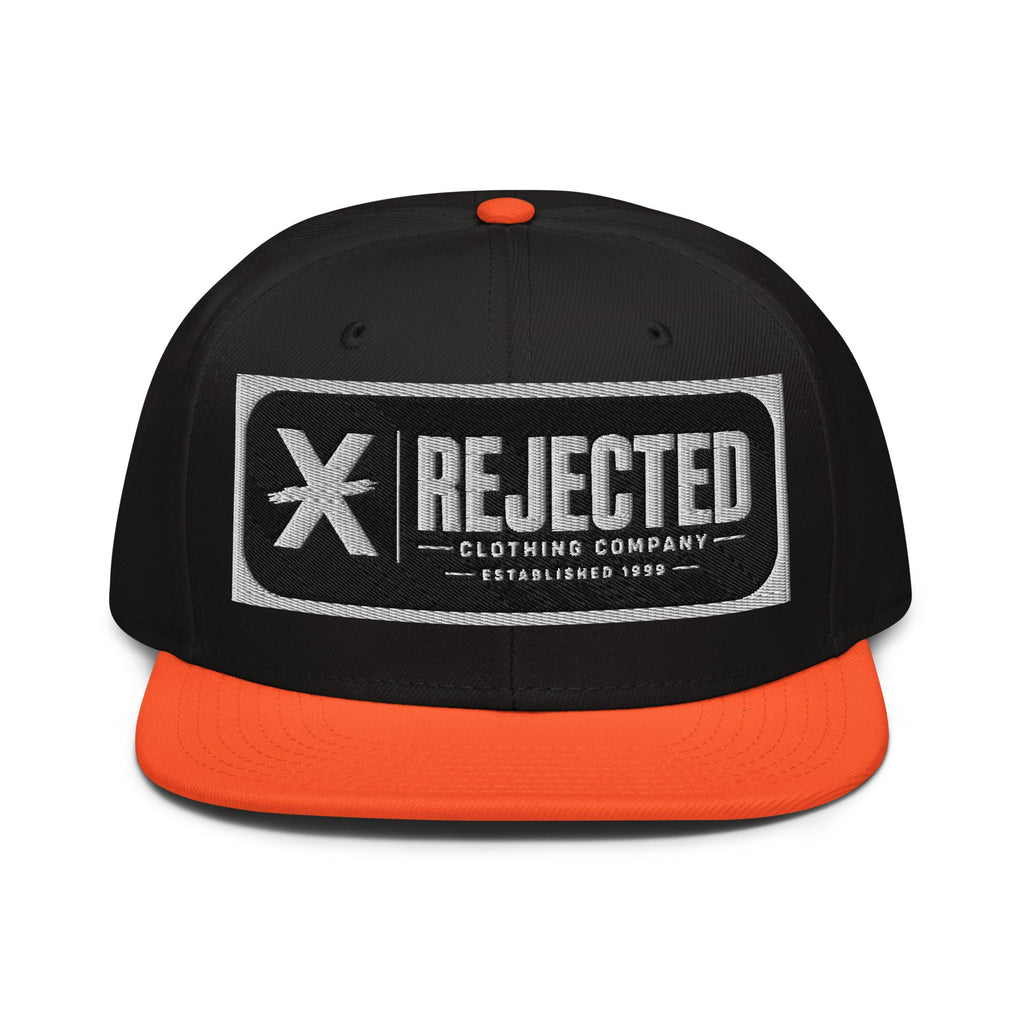 Black snapback with a teal brim and an embroidered Rejected Clothing Company Established 1999 patch